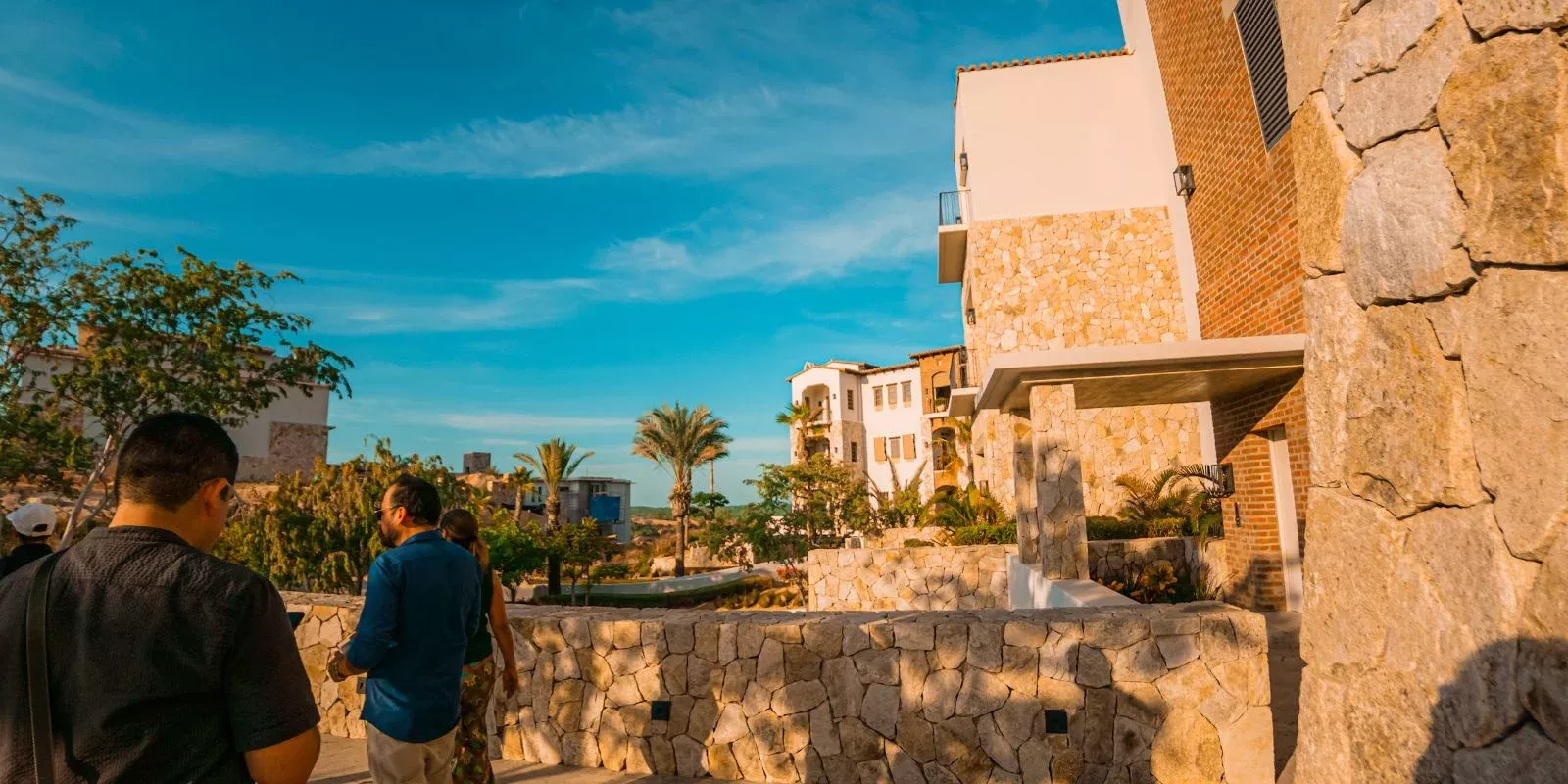Stone architecture and palms in Querencia, Los Cabos