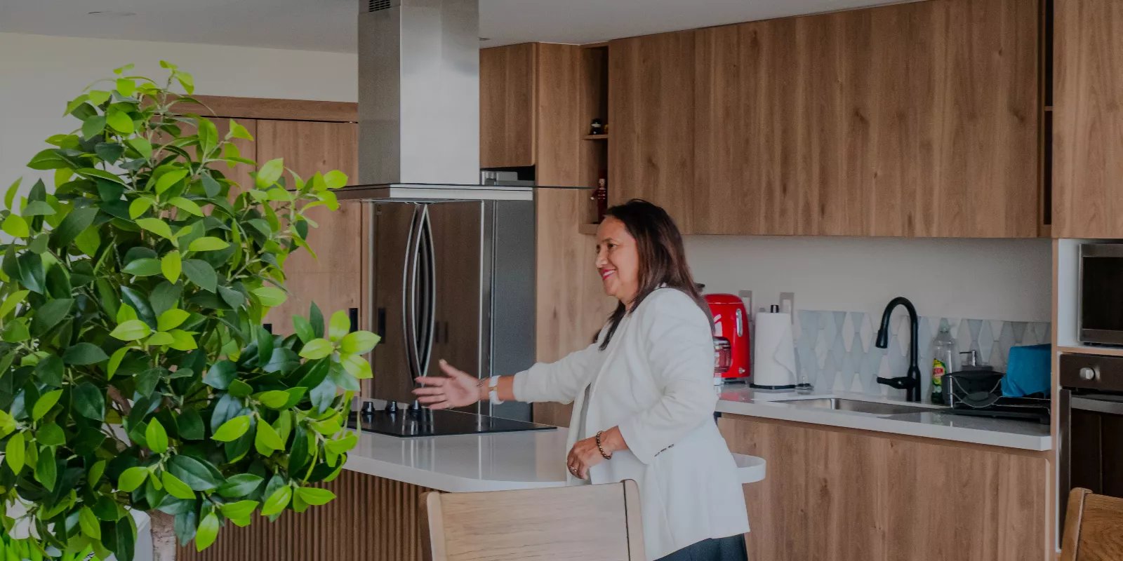 Tu Casa Cabo real estate agent showing a luxury home kitchen to clients in Los Cabos